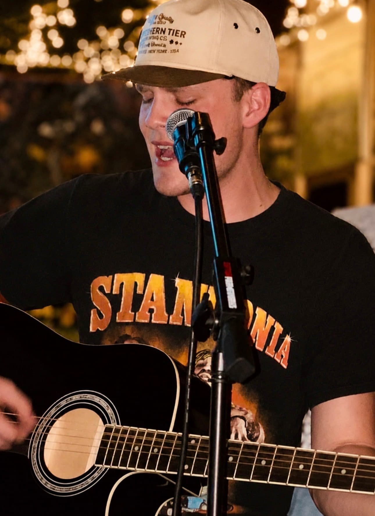 Ben Cornell singing and playing guitar